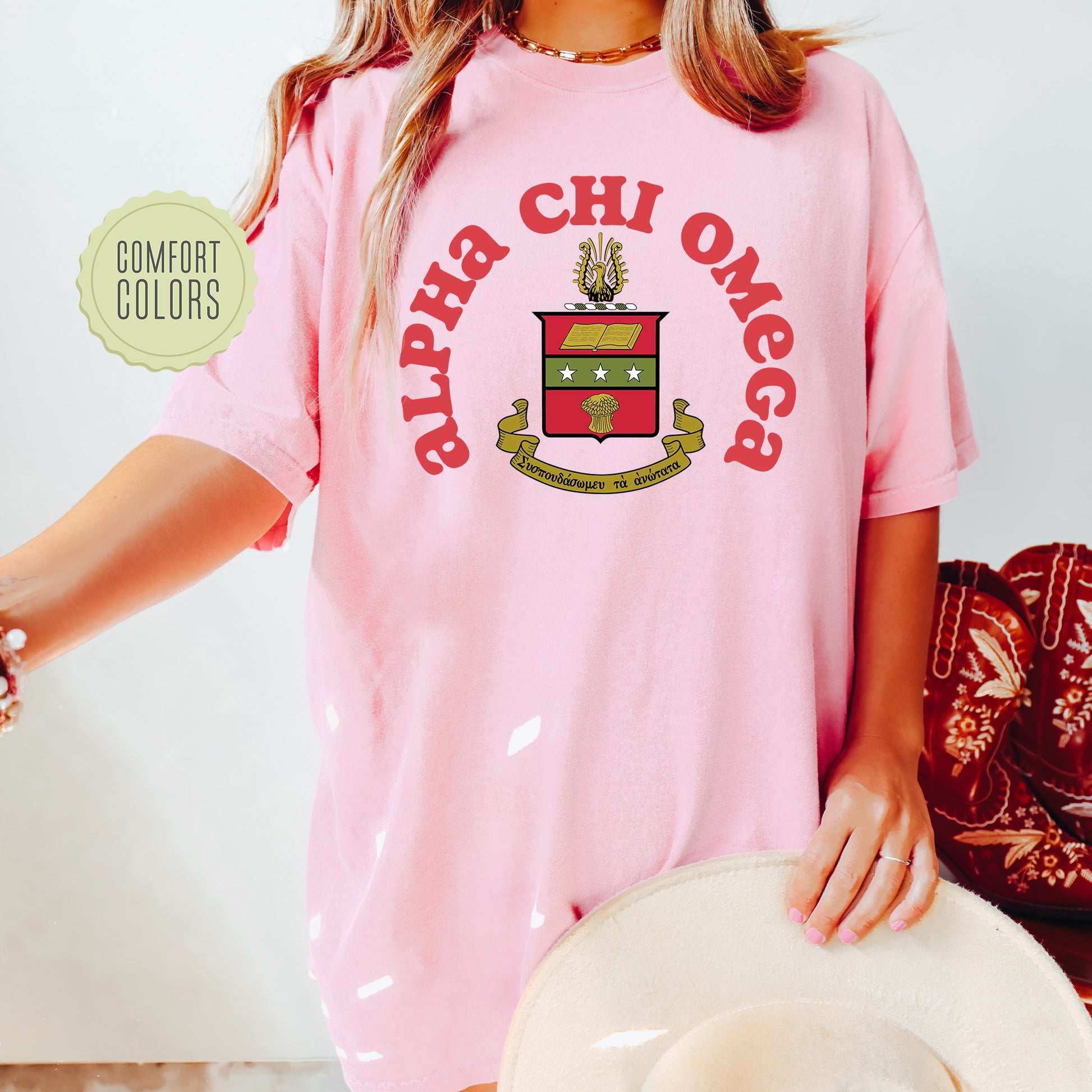 a woman wearing a pink shirt and hat