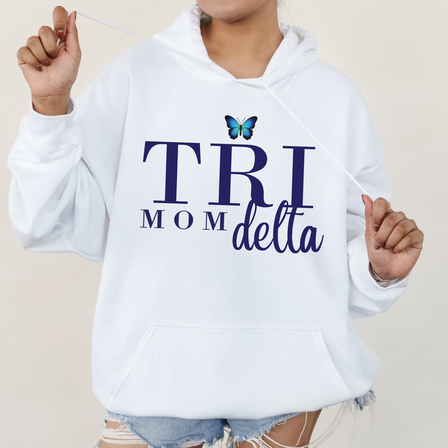 a woman wearing a white hoodie with a butterfly on it