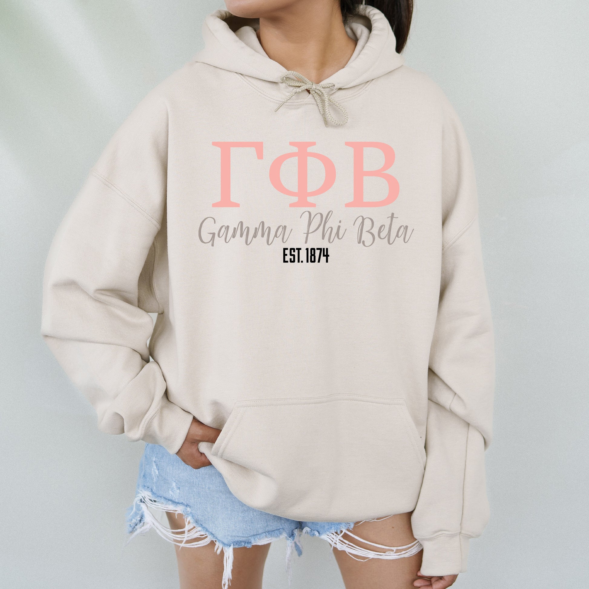 a woman wearing a hoodie with the word topb on it