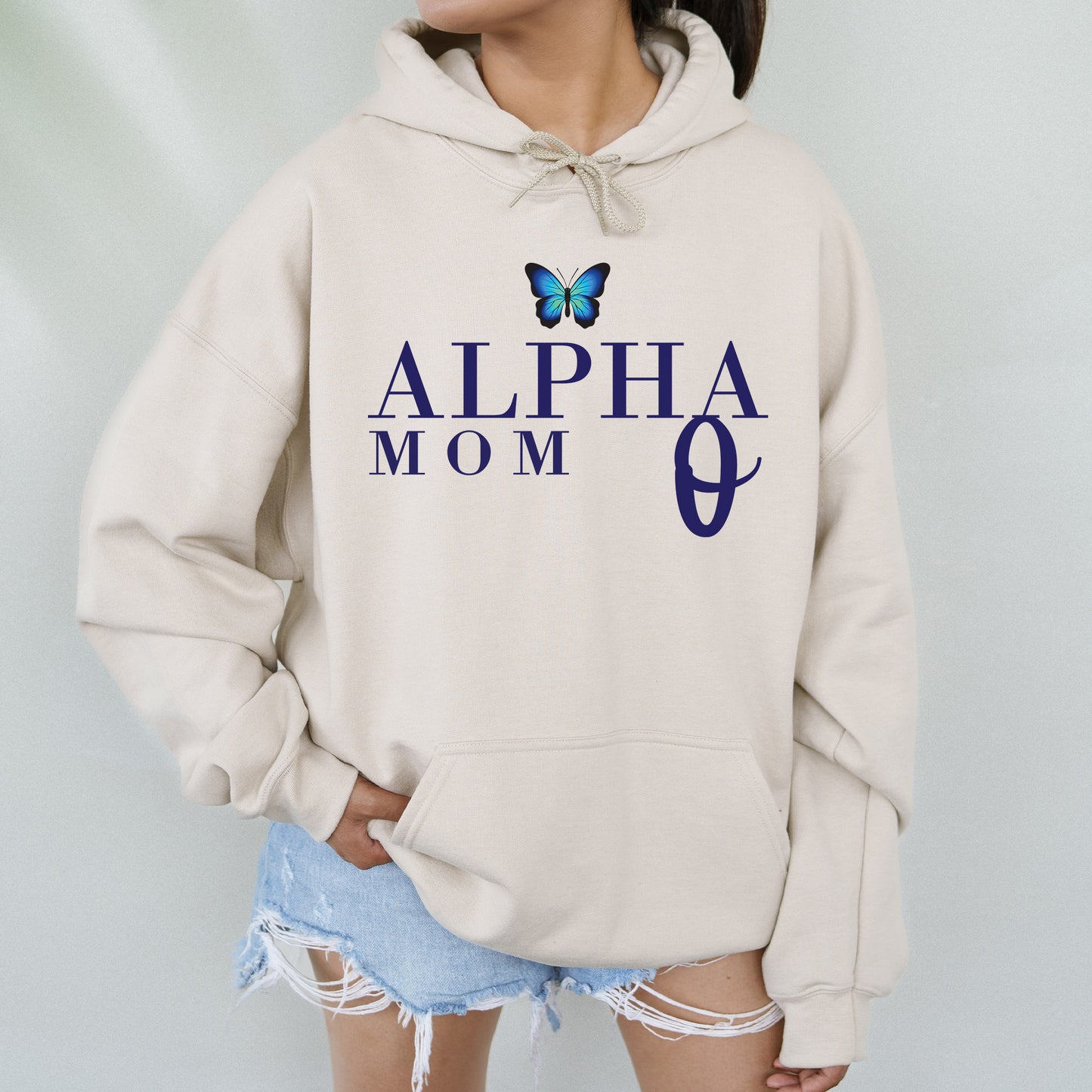 a woman wearing a sweatshirt with a butterfly on it