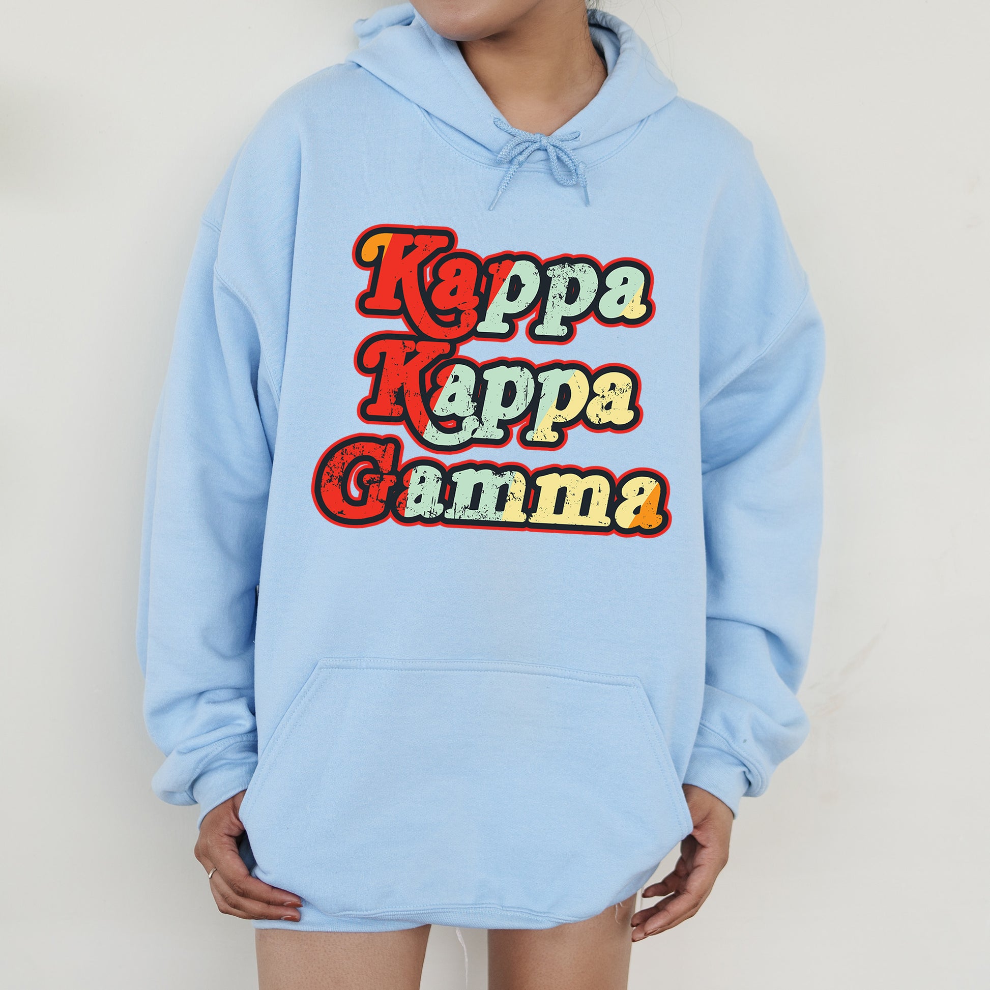 a person wearing a blue hoodie with the words kapp kapp on it