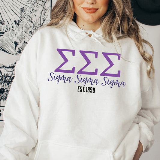 a woman wearing a white hoodie with purple letters