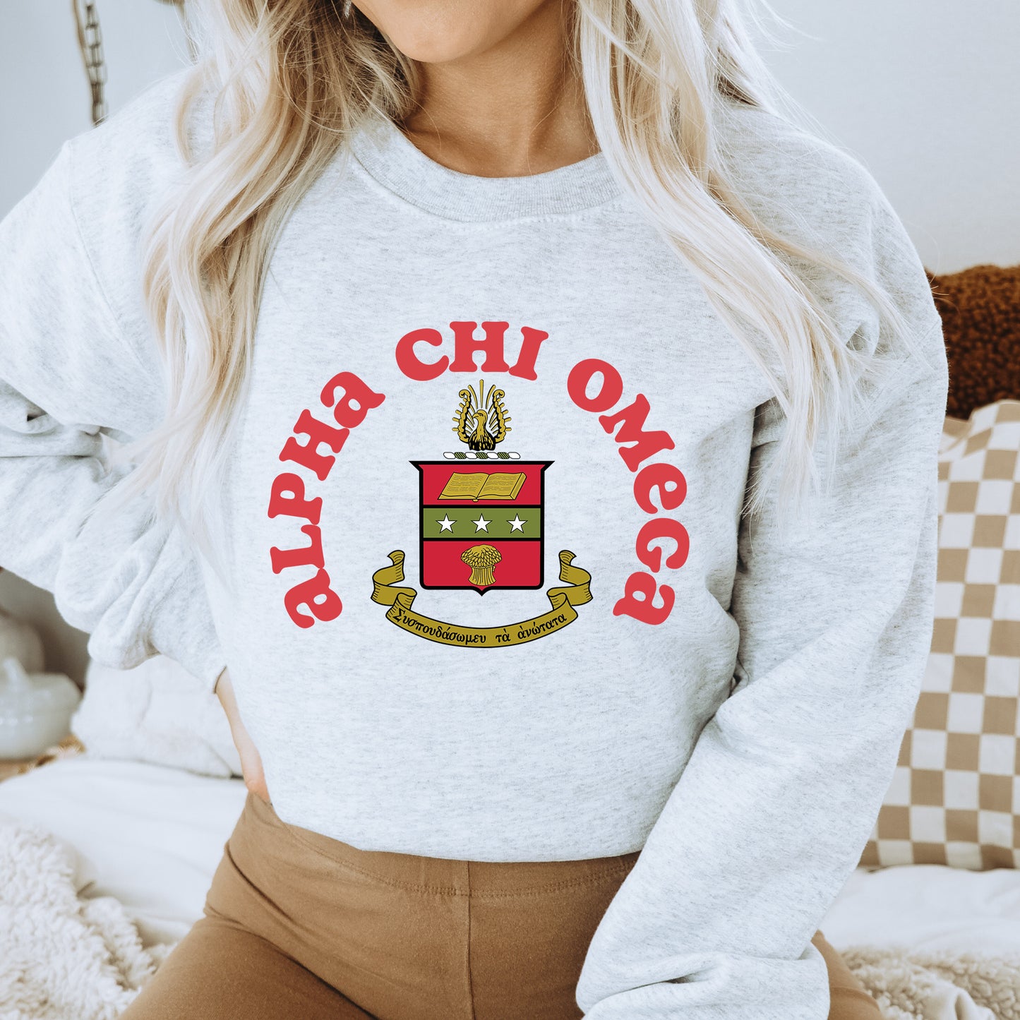 a woman wearing a sweatshirt with a crest on it
