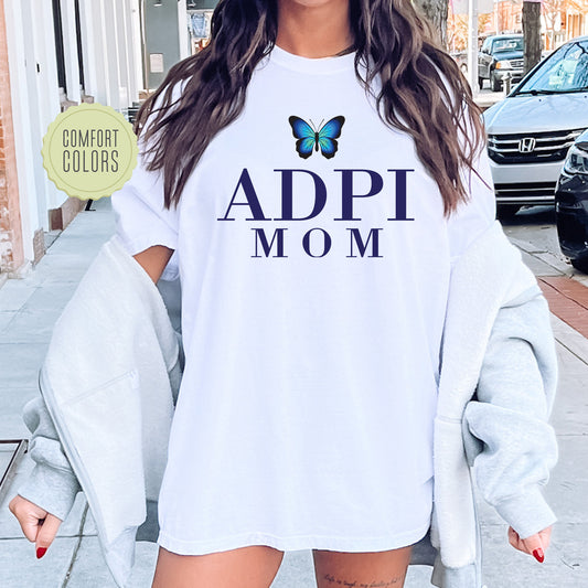 a woman with a butterfly on her shirt