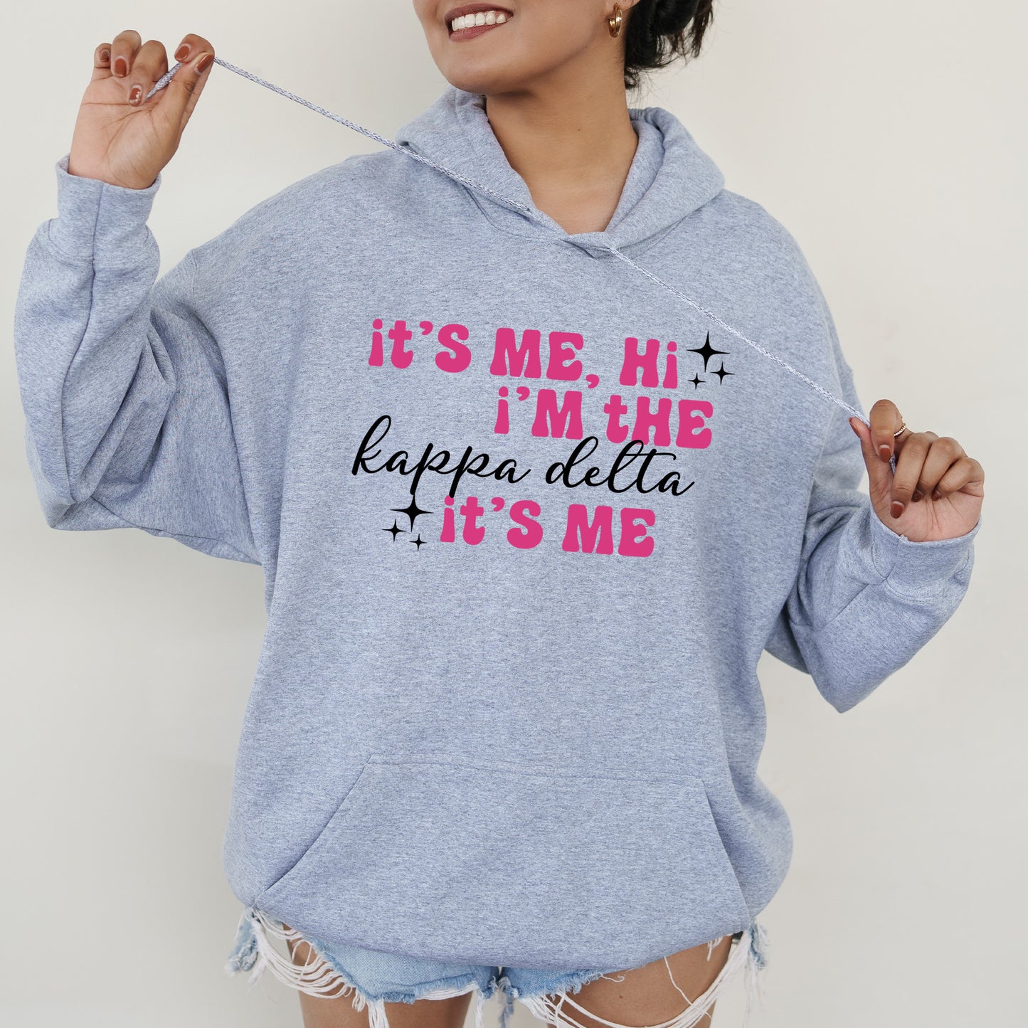 a woman wearing a hoodie that says it's me, i'm