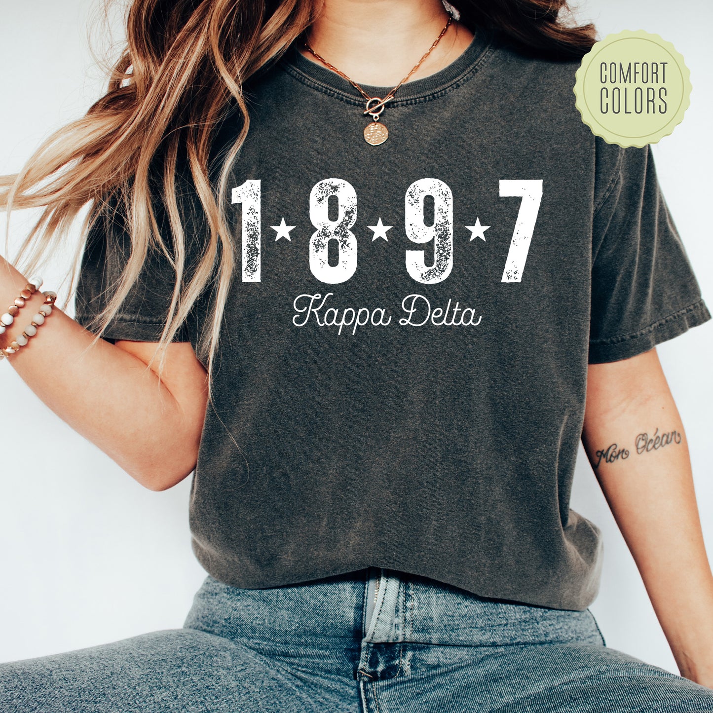 a woman wearing a black shirt that says happy delta