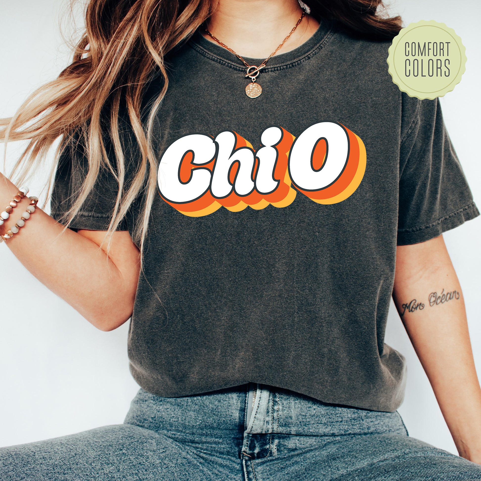 a woman wearing a black shirt with the word chio on it