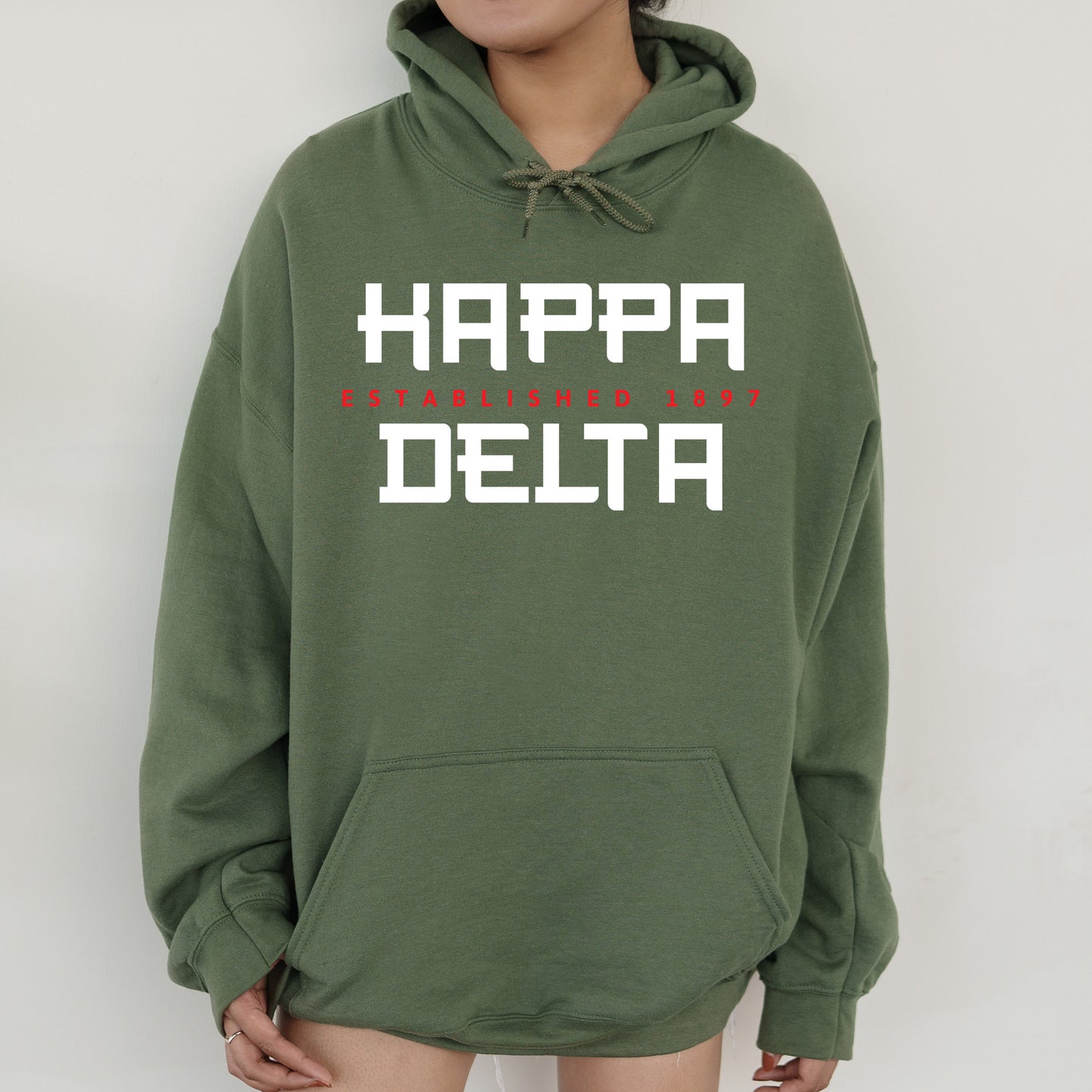 a person wearing a green hoodie that says happy delta