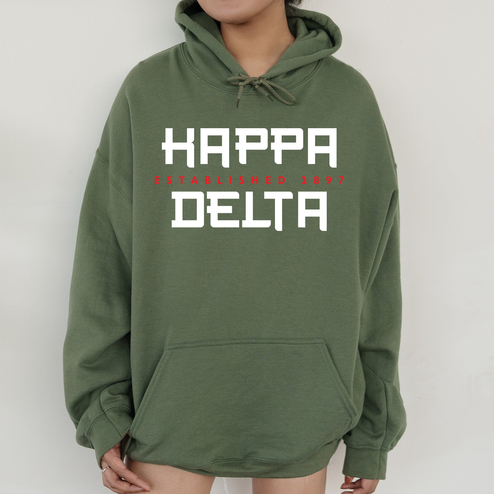 a person wearing a green hoodie that says happy delta