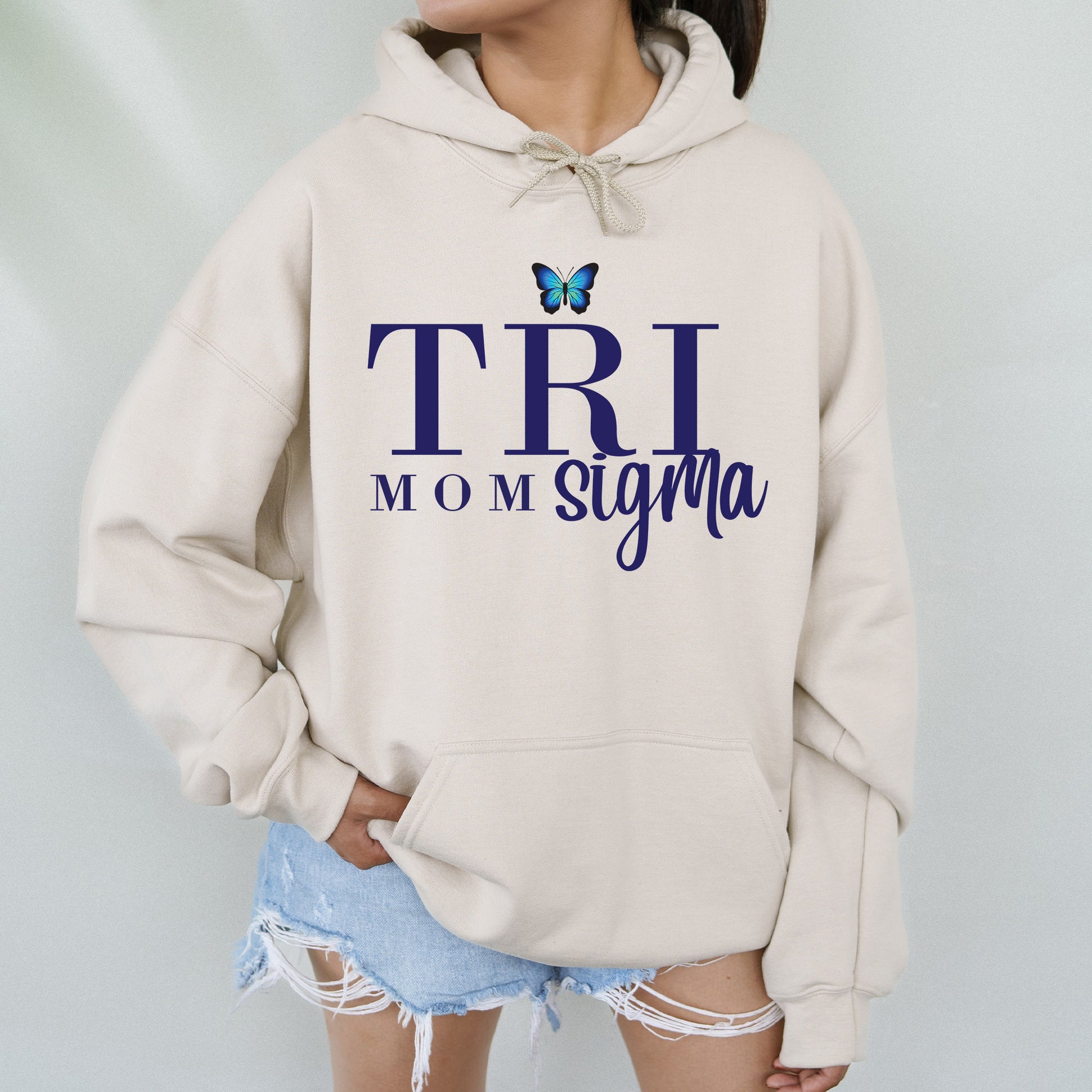 a woman wearing a white sweatshirt with a butterfly on it
