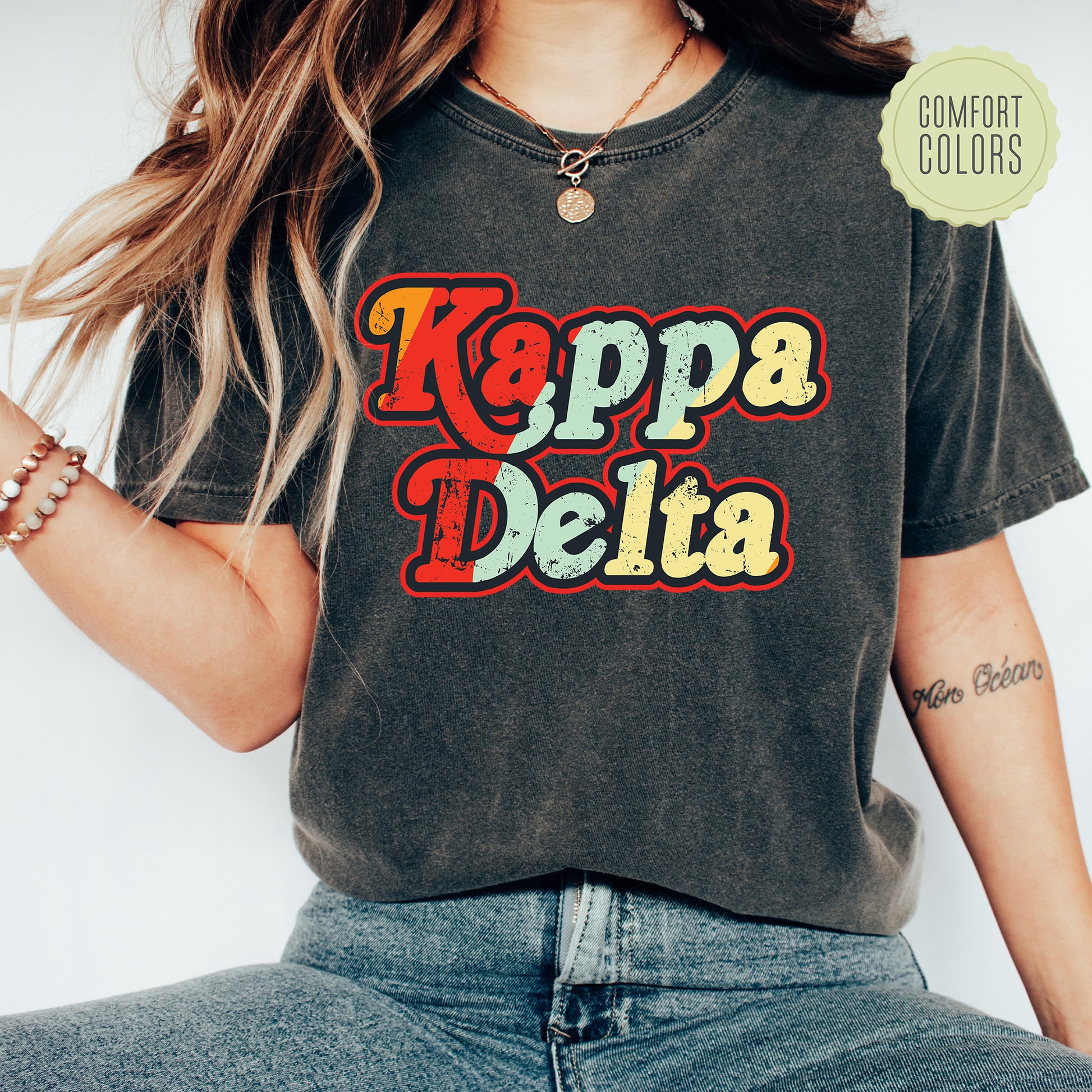 a woman wearing a t - shirt that says kappa delta