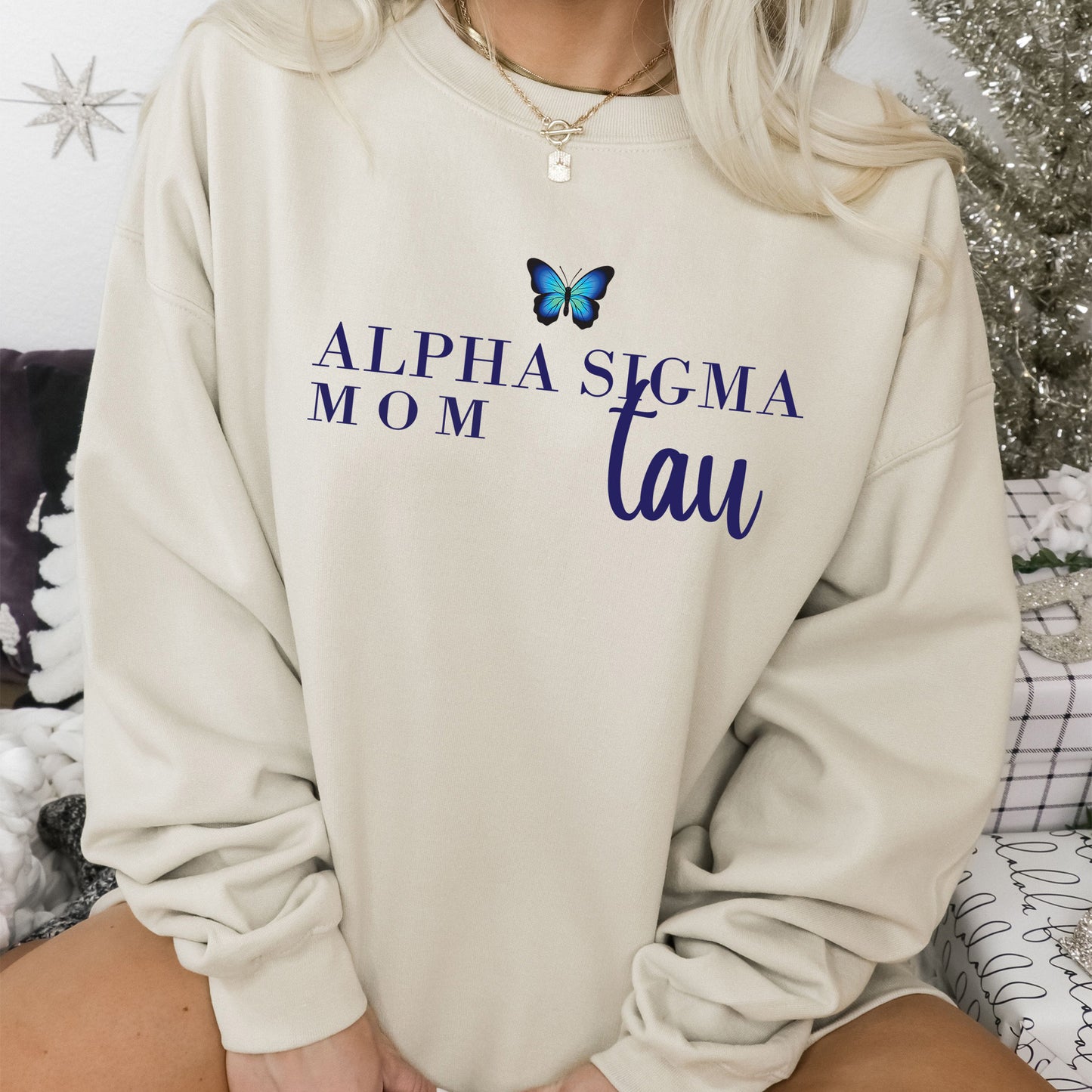 a woman wearing a sweatshirt with a butterfly on it