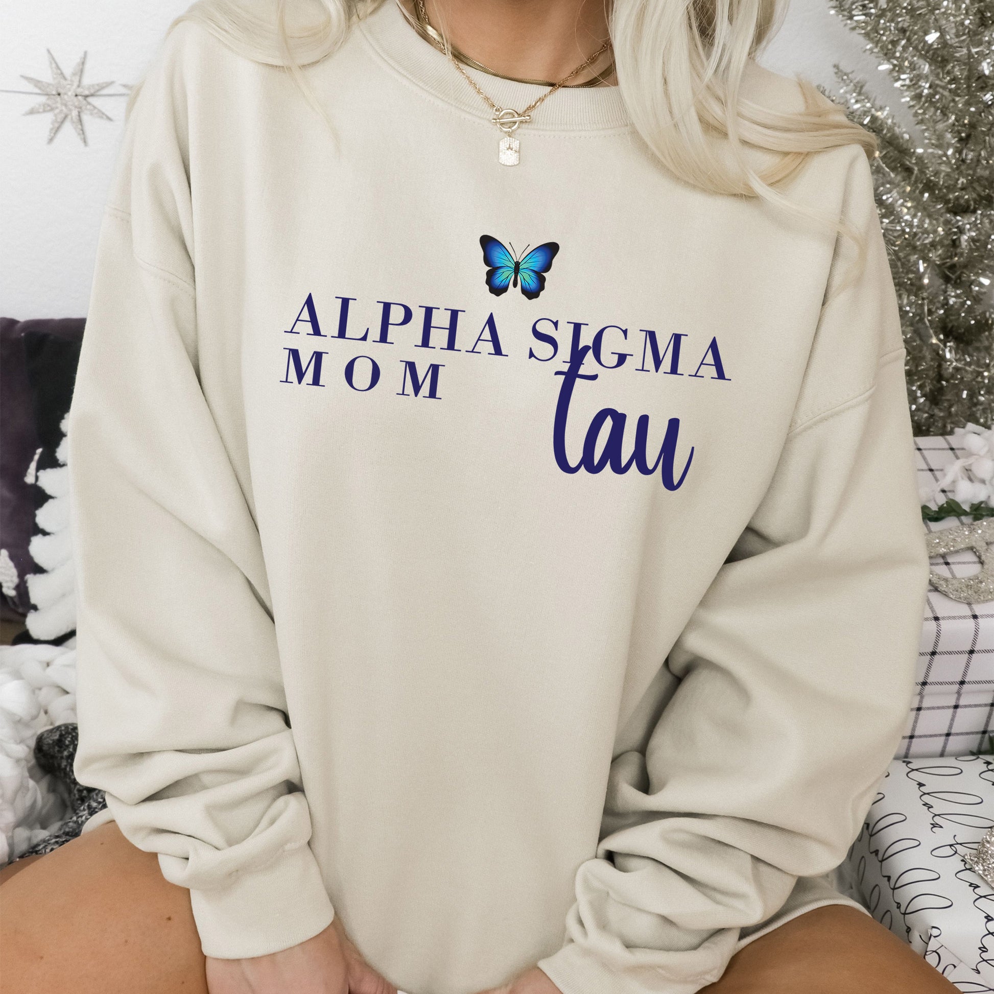 a woman wearing a sweatshirt with a butterfly on it