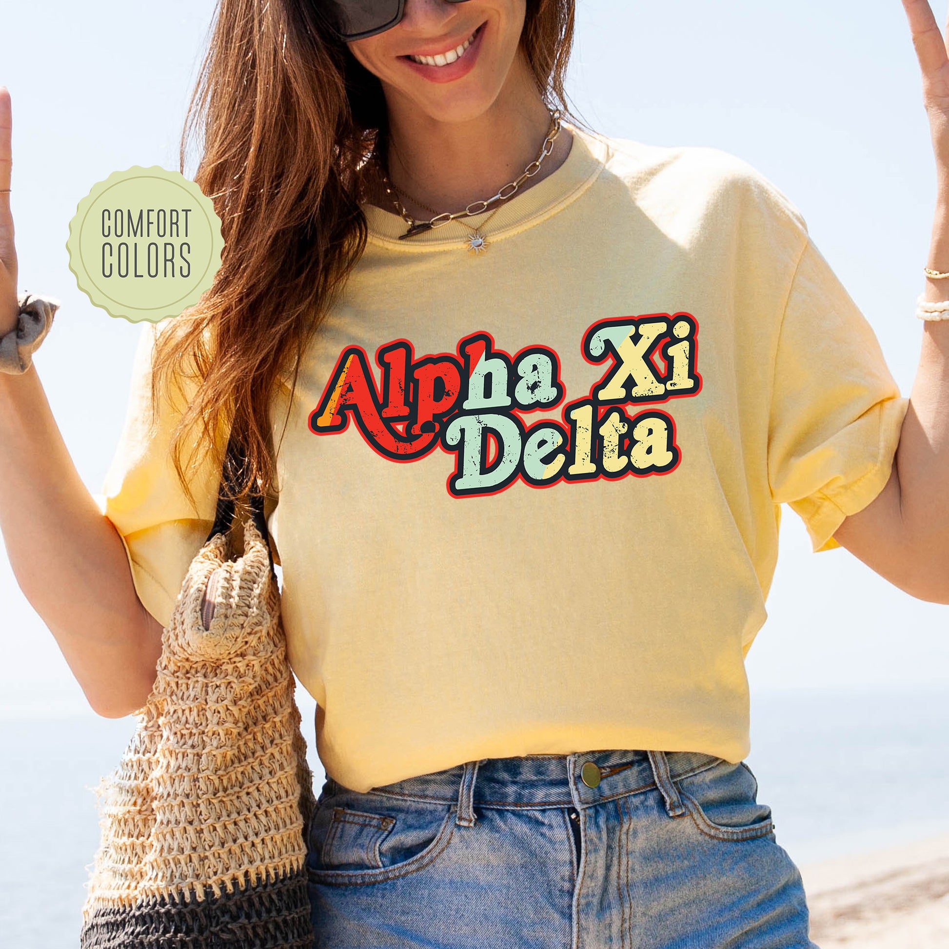 a woman in a yellow shirt holding up a peace sign