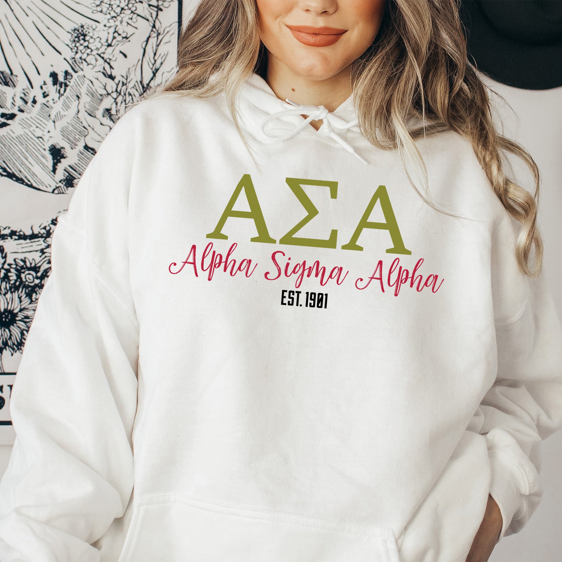 a woman wearing a white hoodie with the word aza on it