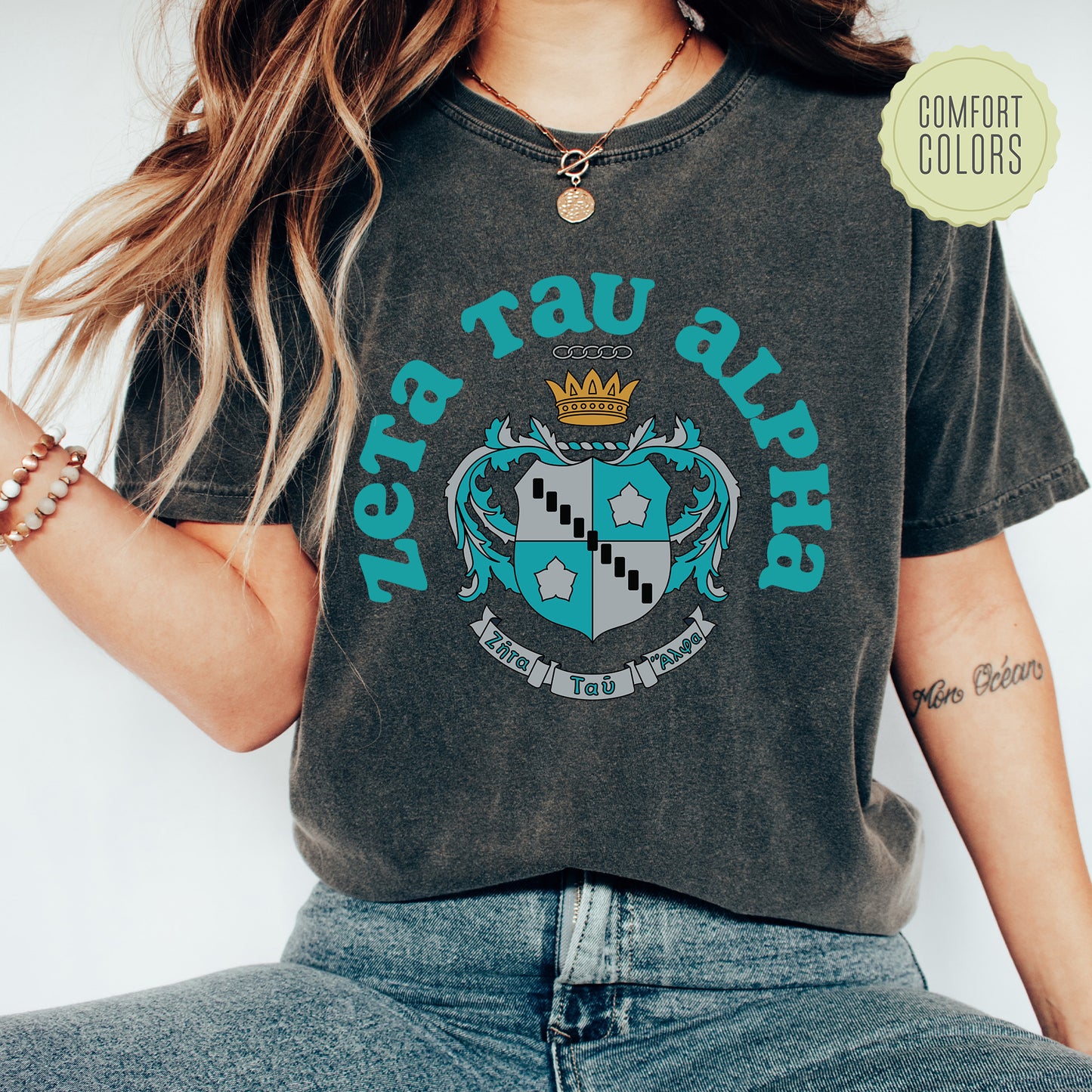 a woman wearing a t - shirt with a crown on it