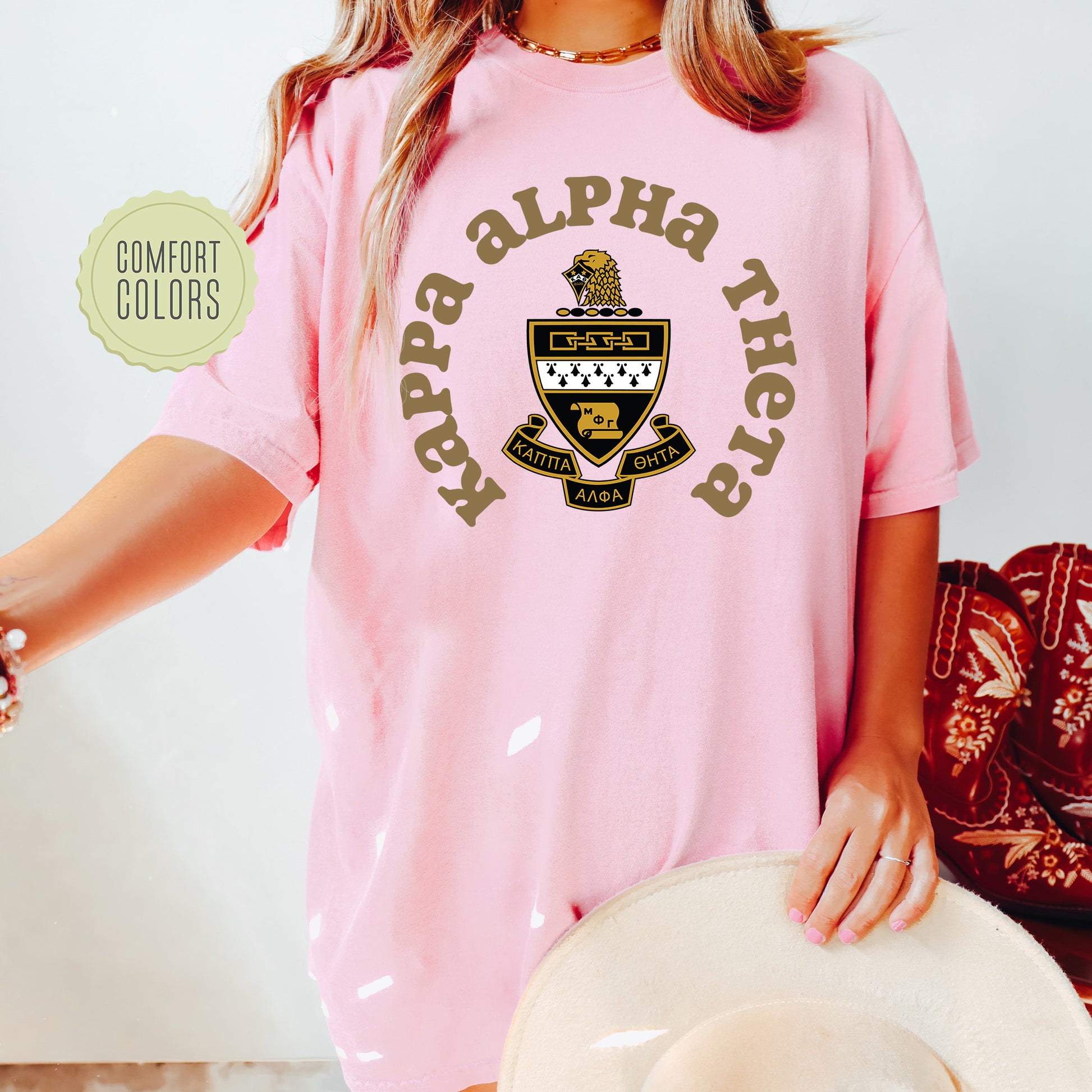 a woman wearing a pink shirt and hat