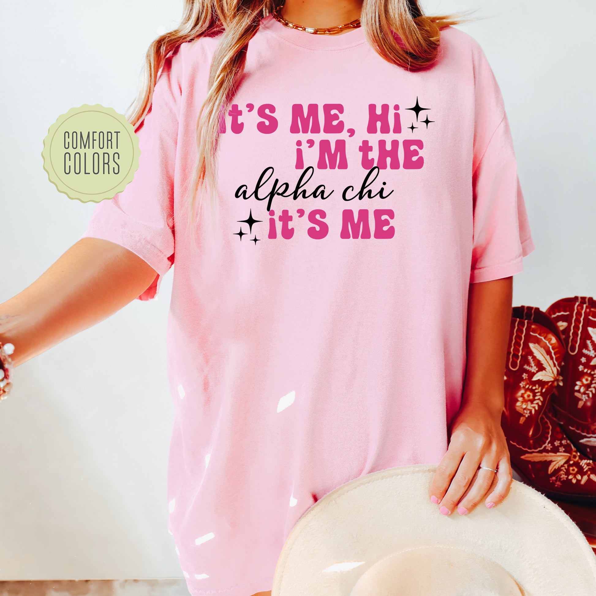 a woman wearing a pink shirt and hat
