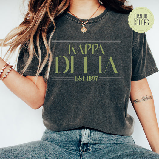 a woman wearing a t - shirt that says i'm happy delta est 1897