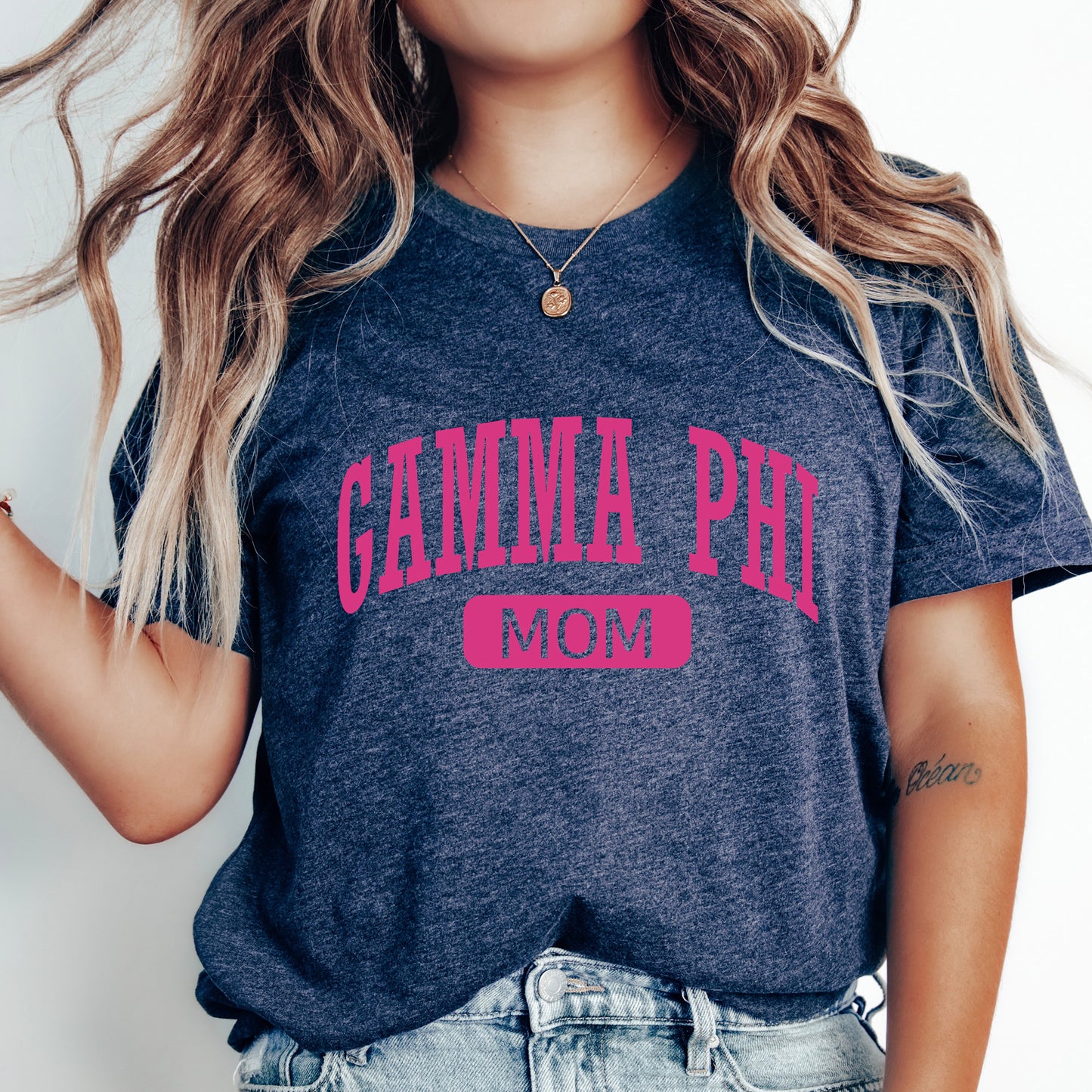 a woman wearing a t - shirt that says camma phi mom