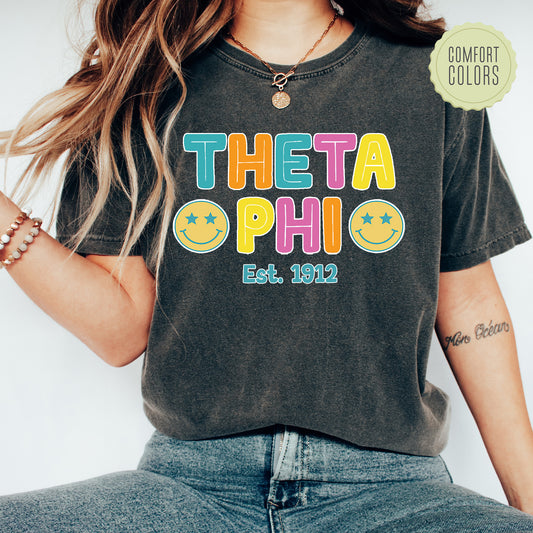 a woman wearing a t - shirt that says thea phi