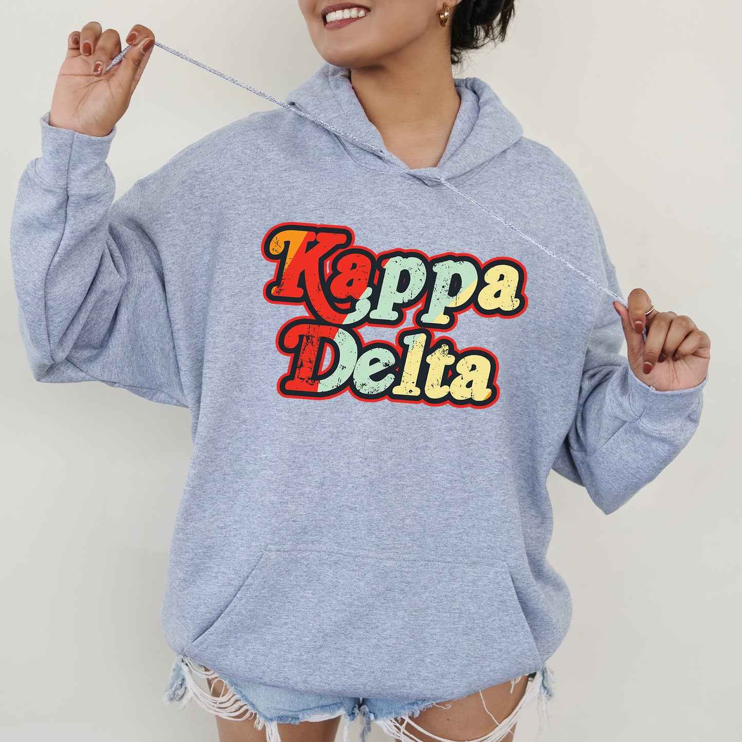 a woman wearing a blue hoodie with the words pepa delta printed on it