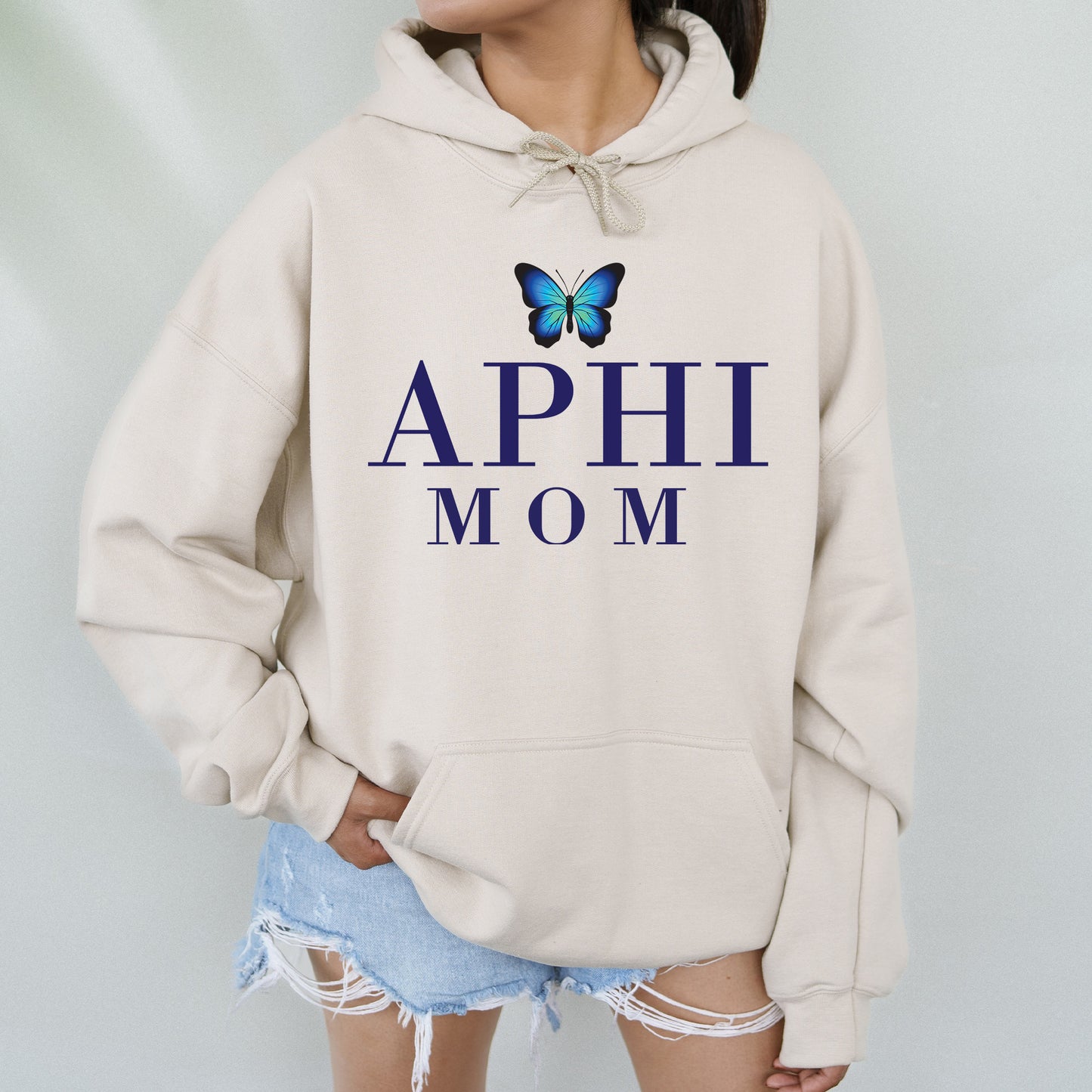 a woman wearing a sweatshirt with a butterfly on it
