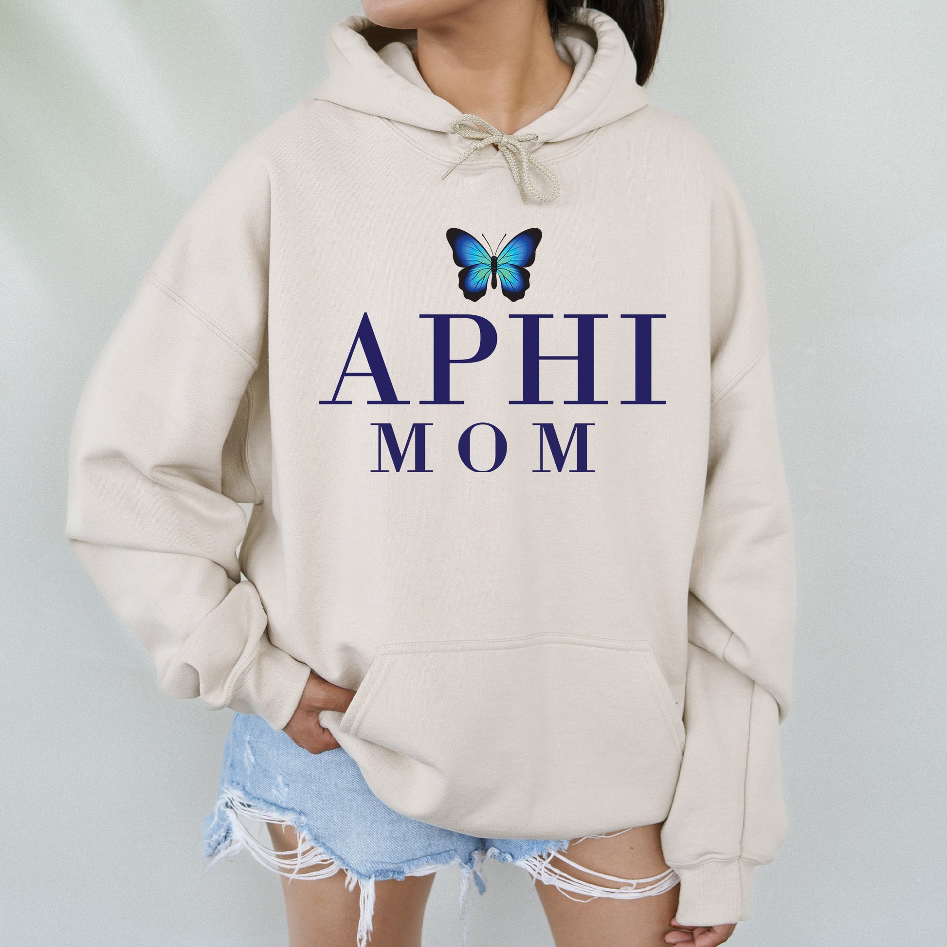 a woman wearing a sweatshirt with a butterfly on it