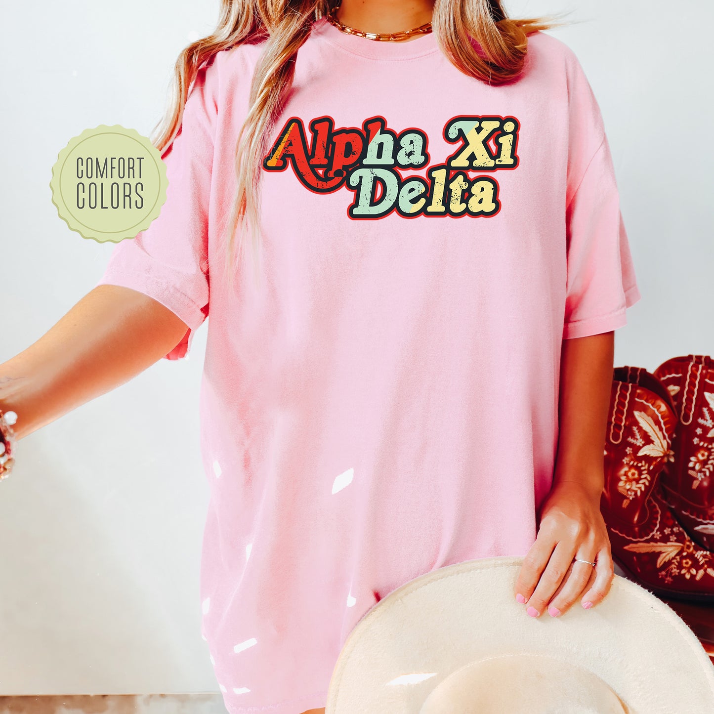 a woman wearing a pink shirt and hat