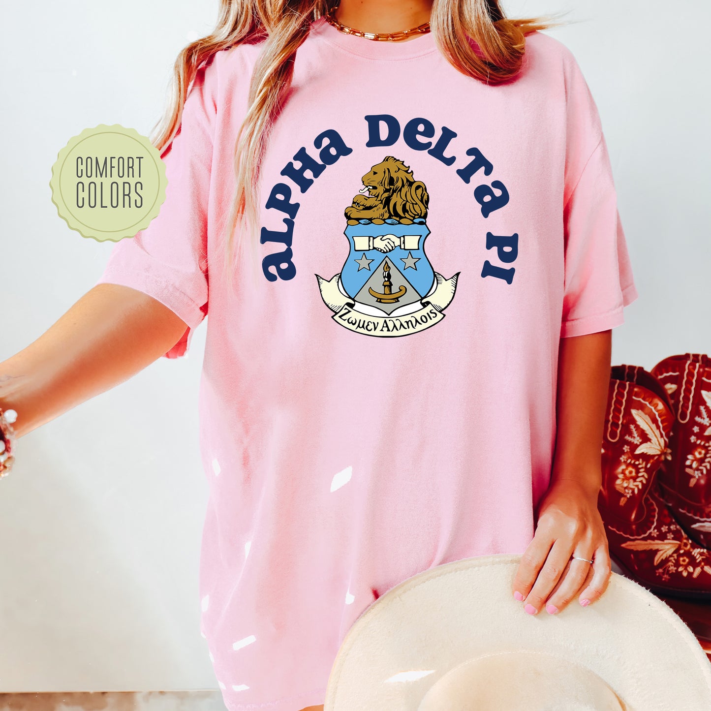 a woman wearing a pink shirt and hat