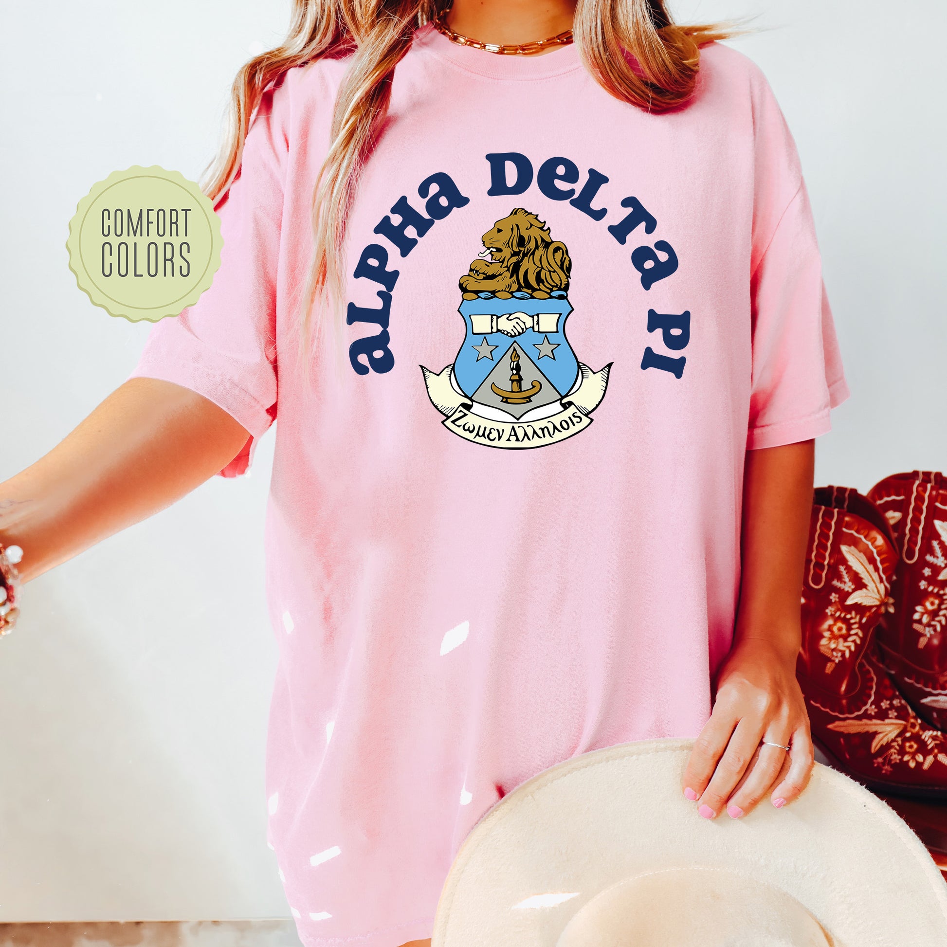a woman wearing a pink shirt and hat