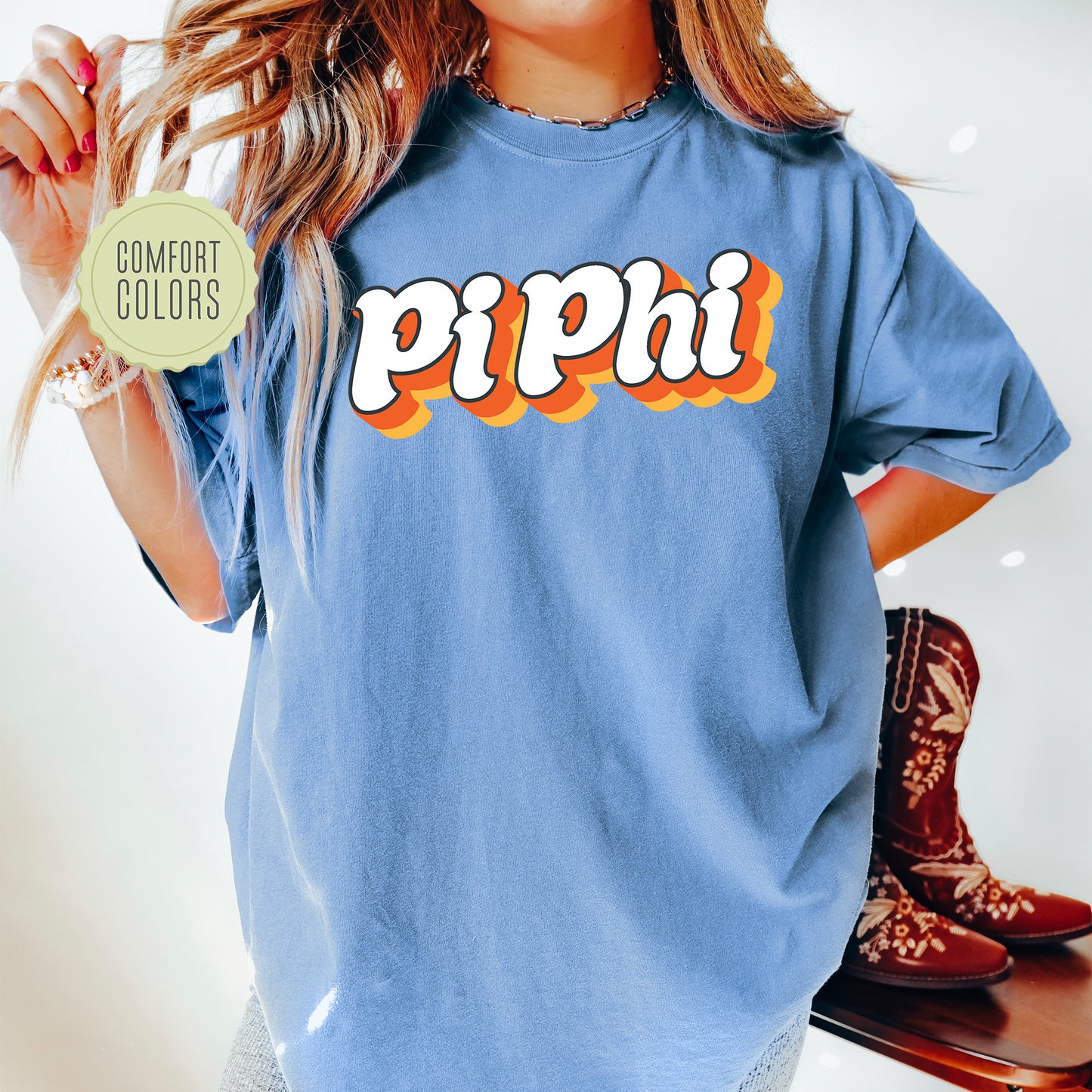 a woman wearing a blue shirt with the word piphi on it
