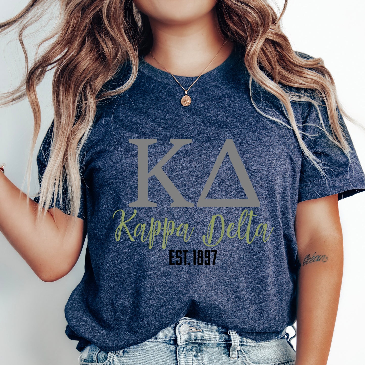 a woman with long hair wearing a t - shirt that says kauppa delta