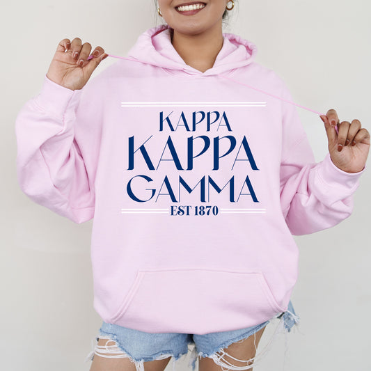 a woman wearing a pink hoodie with the words kappa kappa