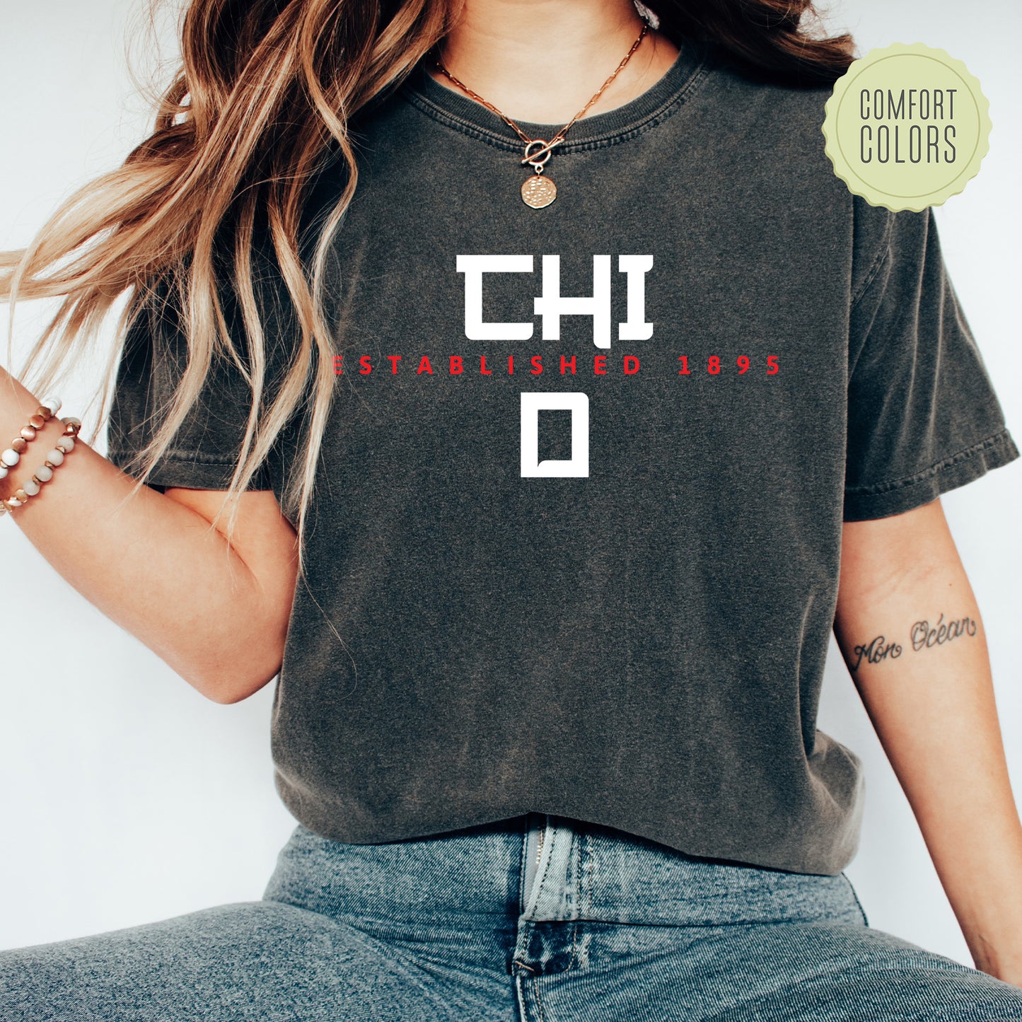a woman wearing a black shirt with the words chd on it