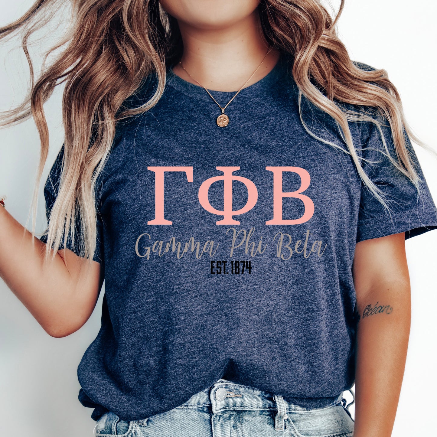 a woman wearing a t - shirt with the letters phi and phi on it