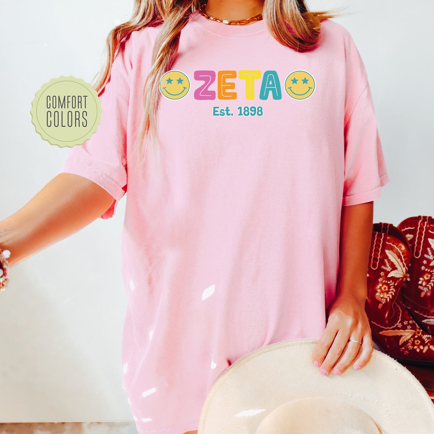 a woman wearing a pink shirt and hat