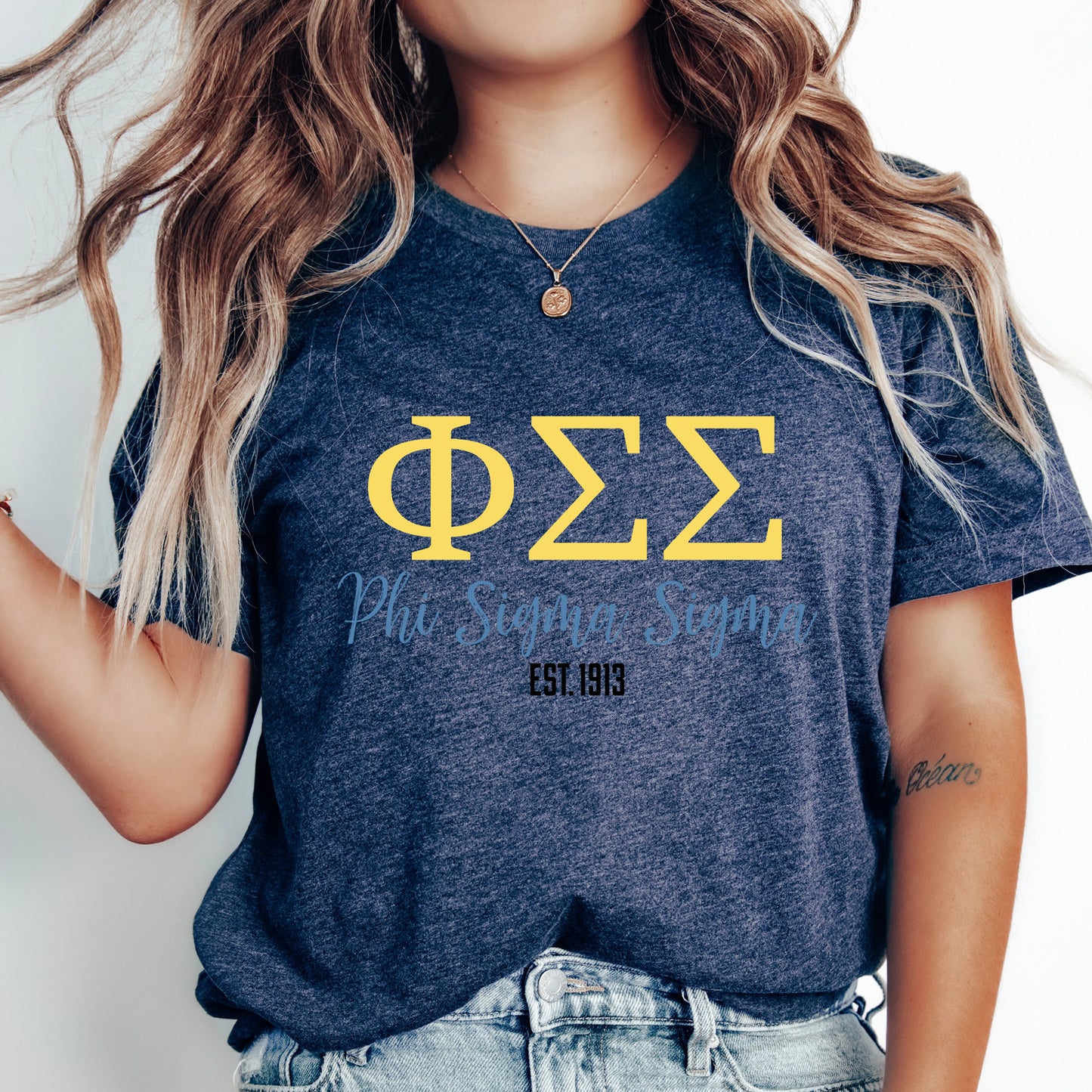 a woman with long hair wearing a phi phi shirt