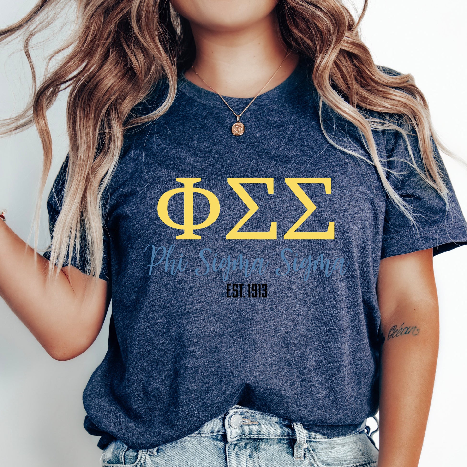 a woman with long hair wearing a phi phi shirt