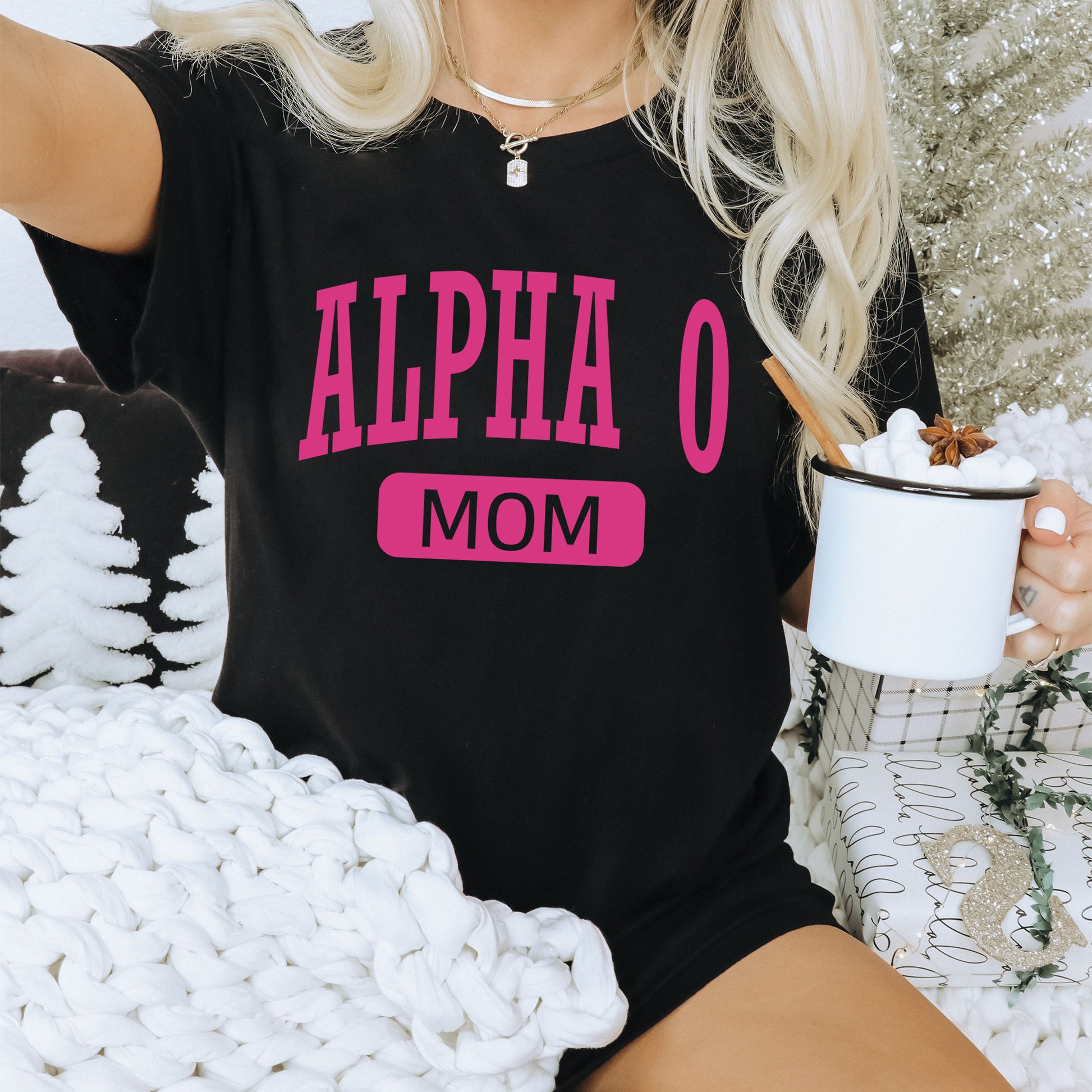 a woman sitting on a couch holding a cup of coffee