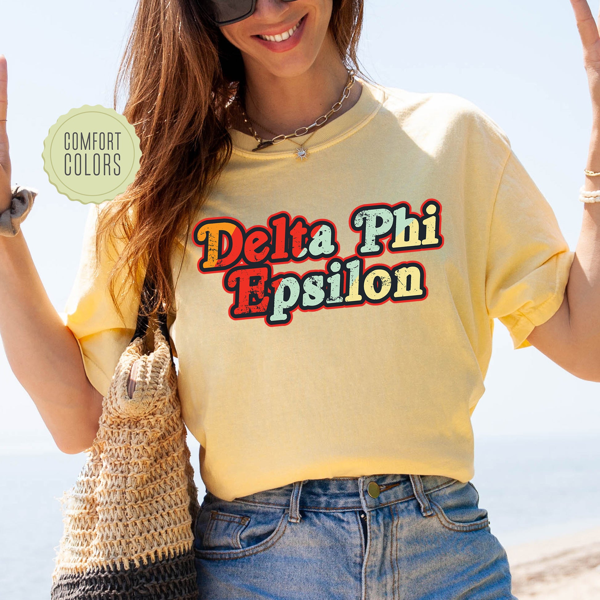 a woman in a yellow shirt is holding up a peace sign
