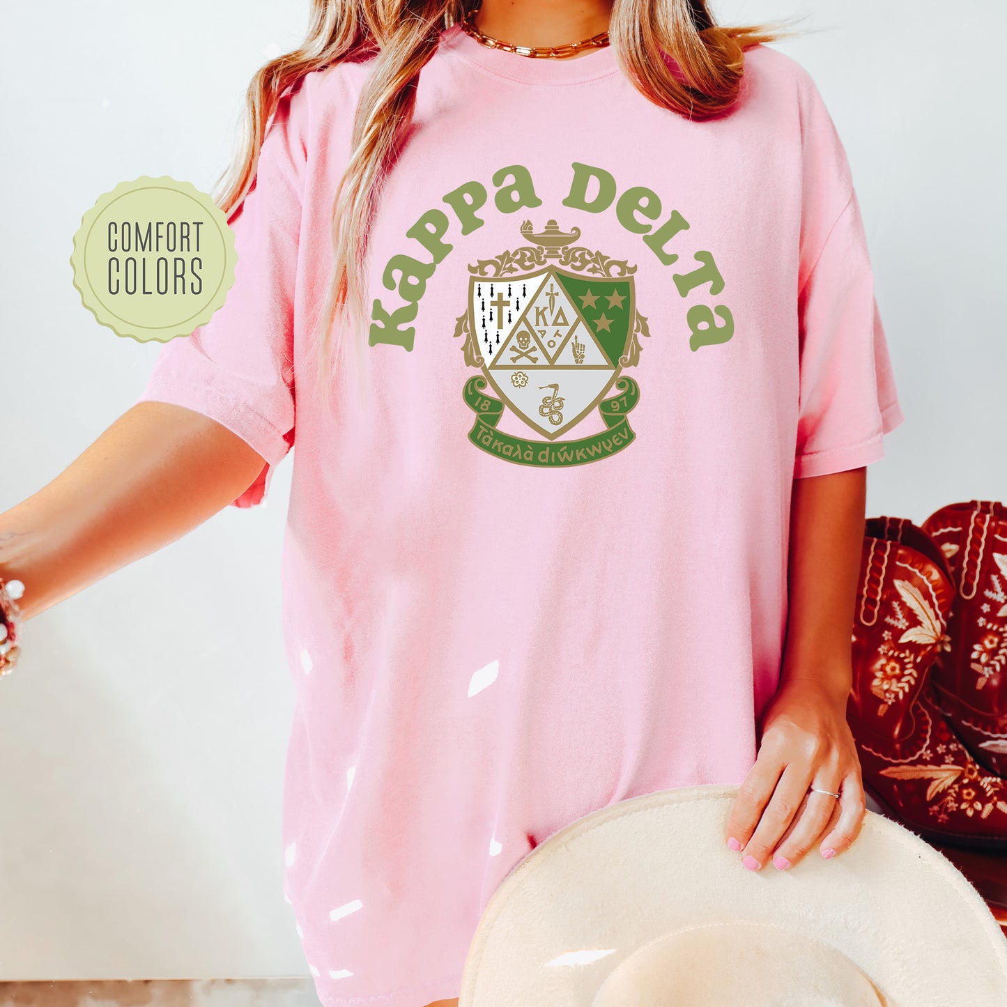 a woman wearing a pink shirt and hat