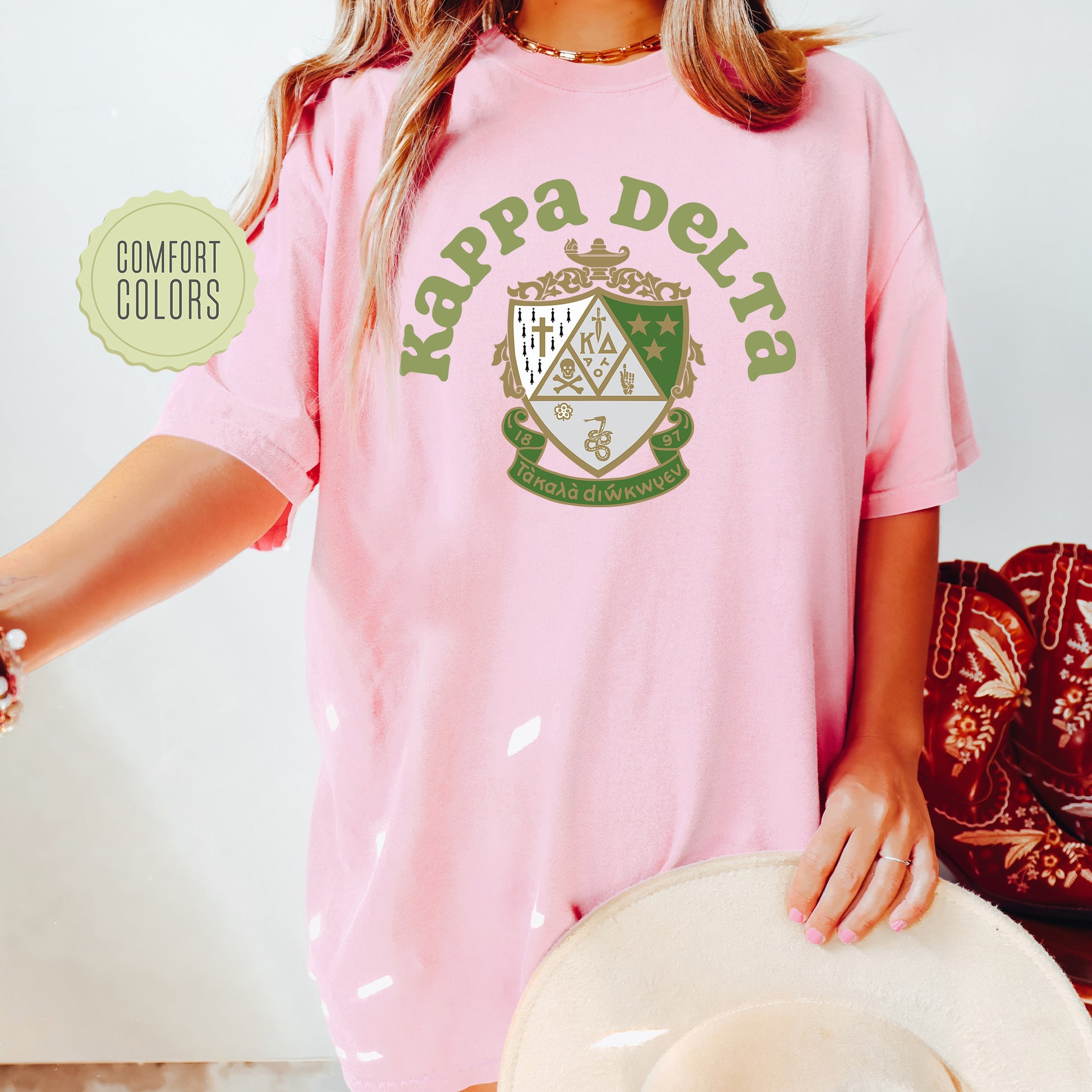 a woman wearing a pink shirt and hat
