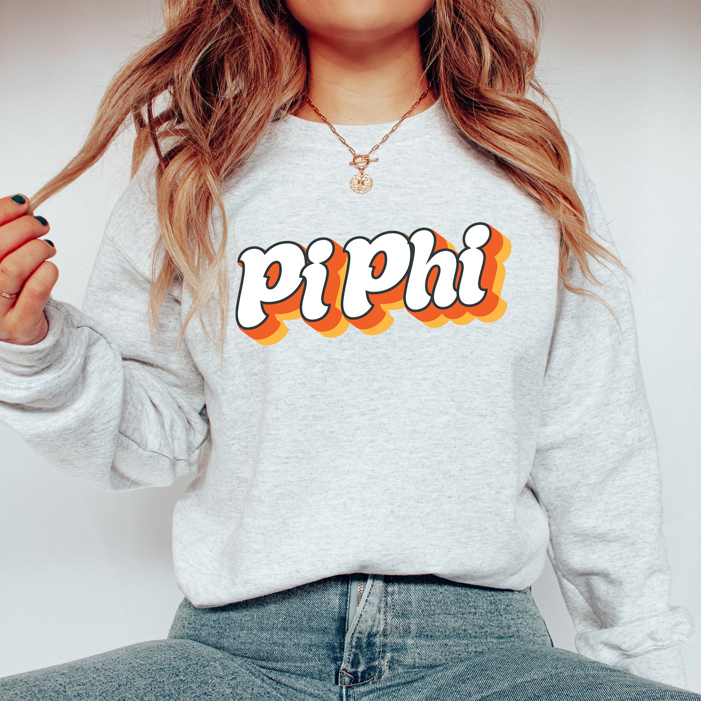 a woman wearing a sweatshirt with the word pippi on it