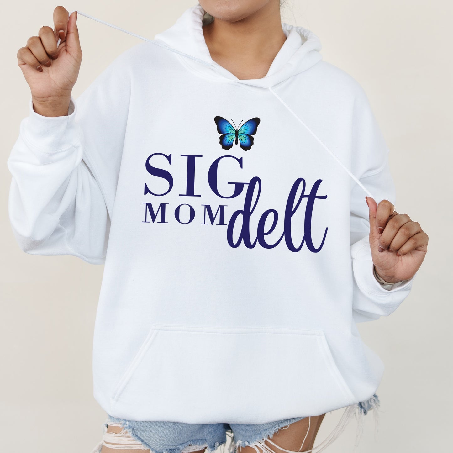 a woman wearing a white hoodie with a butterfly on it