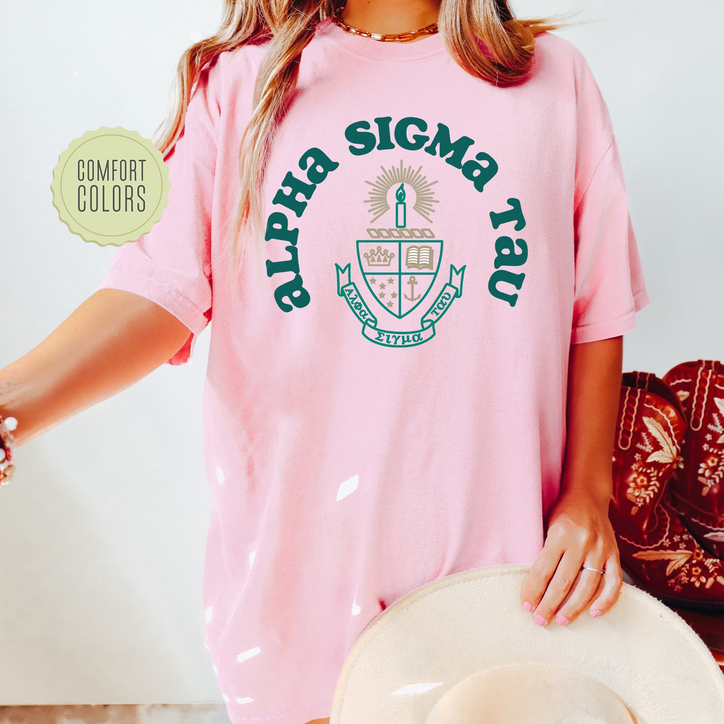 a woman wearing a pink shirt and hat