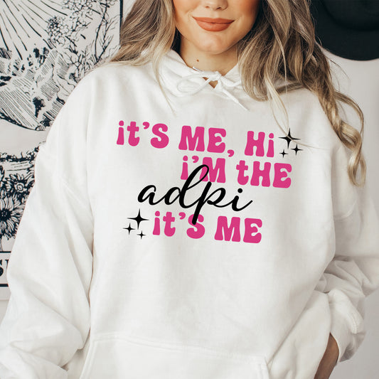 a woman wearing a white hoodie that says it's me, he in