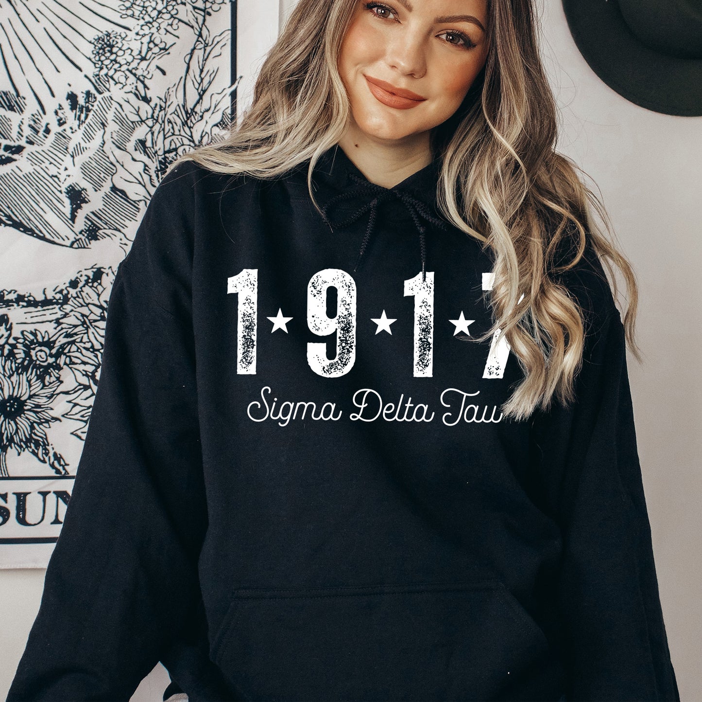 a woman wearing a black hoodie with the year 1971 printed on it