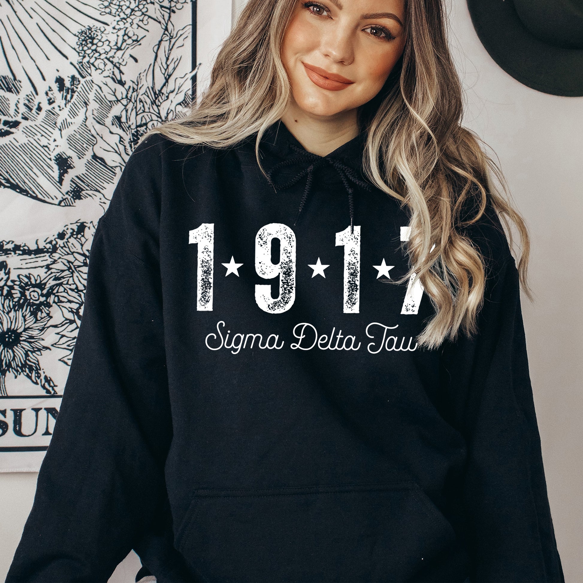 a woman wearing a black hoodie with the year 1971 printed on it