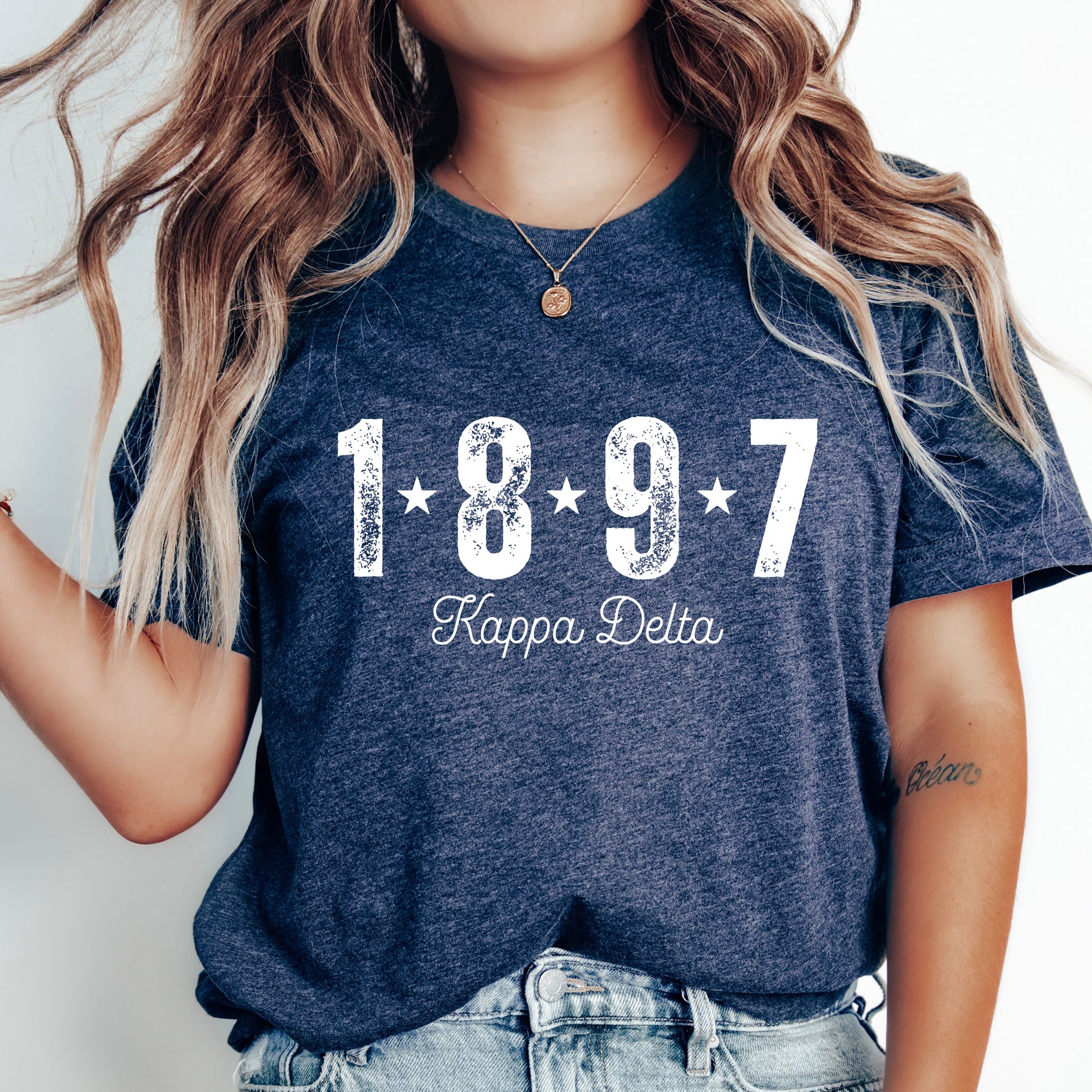 a woman wearing a t - shirt with the year 1897 printed on it